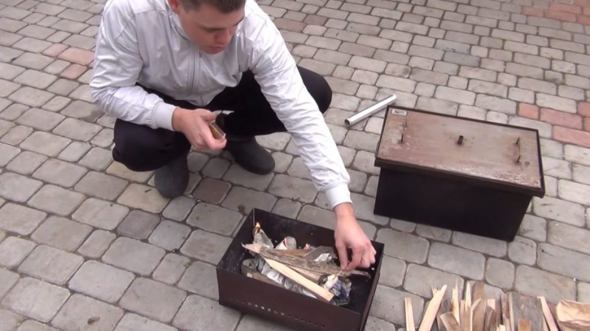 Allumer un feu sous le fumoir