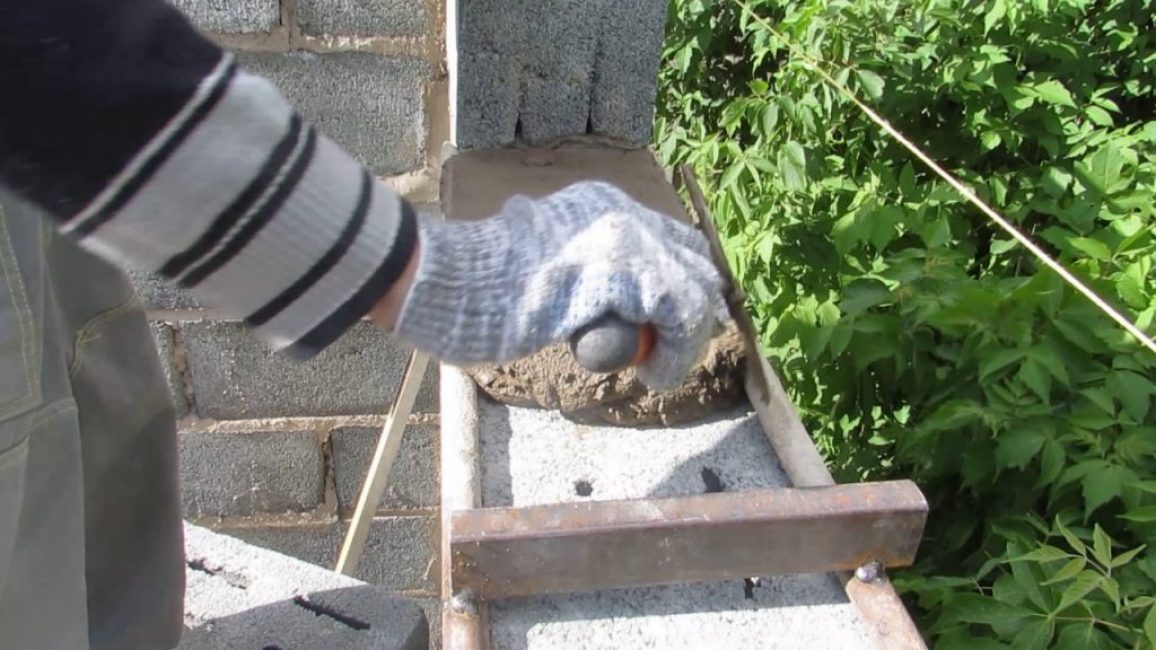 Outil de pose de blocs